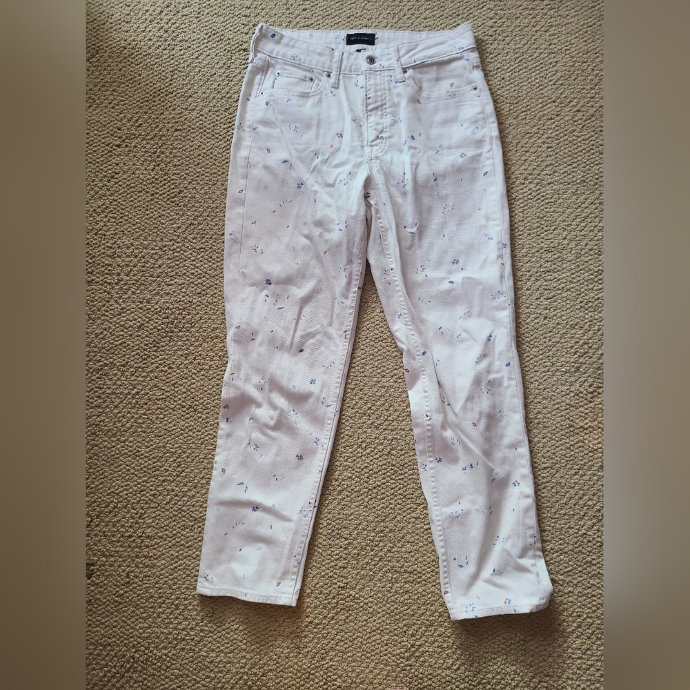 Free assembly white patterned jeans.